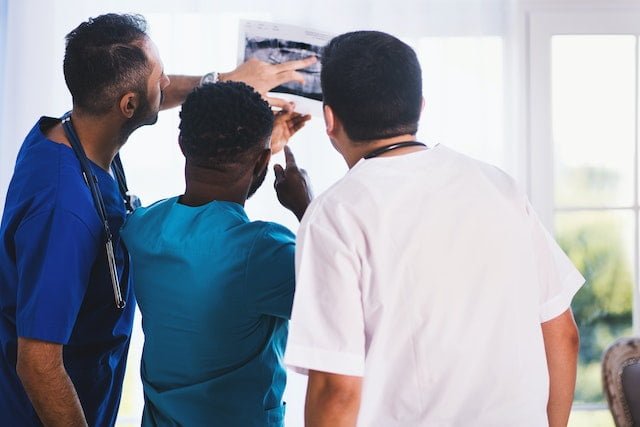 Physicians Looking at X-ray Result 